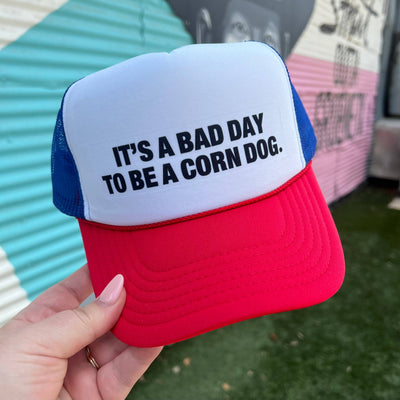 It’s A Bad Day To Be A Corn Dog Trucker Cap (Multiple Color Options)  from Turquoise & Tequila